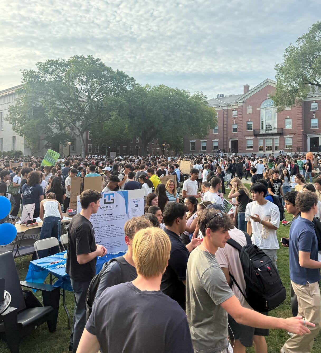 Students crowding around the TAMID Group table at Brown's activities fair